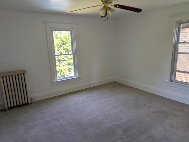 413 N 3rd St, Jeannette, PA 15644 - carpeted spare room featuring radiator heating unit and a ceiling fan