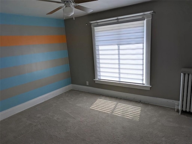 413 N 3rd St, Jeannette, PA 15644 - carpeted empty room with radiator and a ceiling fan