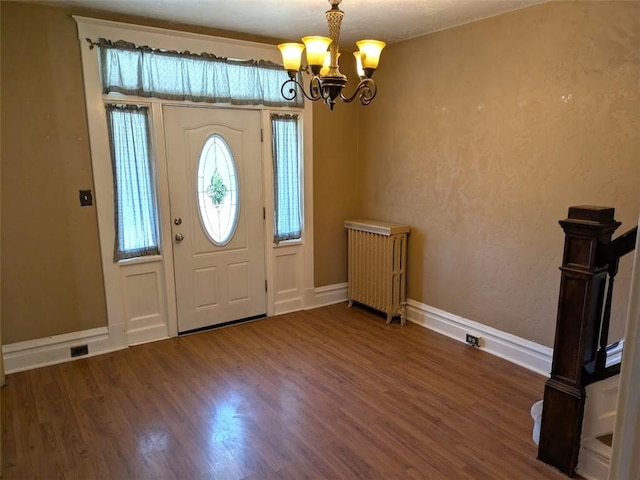 413 N 3rd St, Jeannette, PA 15644 - entrance foyer with a chandelier and wood finished floors
