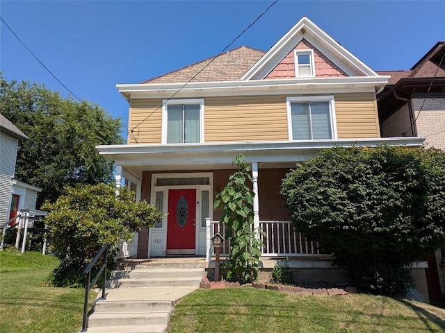 413 N 3rd St, Jeannette, PA 15644 - american foursquare style home with a porch and a front yard
