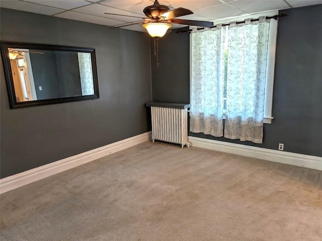 413 N 3rd St, Jeannette, PA 15644 - carpeted spare room featuring a ceiling fan, a drop ceiling, and radiator heating unit