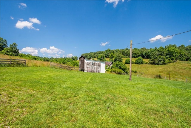 481 Dille Run Rd, Morris Twp, PA 15329 - view of yard featuring a barn, an outbuilding, and a view of countryside