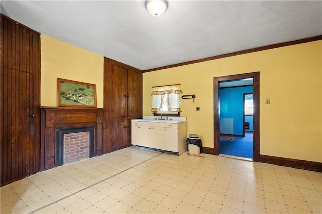 481 Dille Run Rd, Morris Twp, PA 15329 - kitchen featuring light flooring, a fireplace, crown molding, and wooden walls
