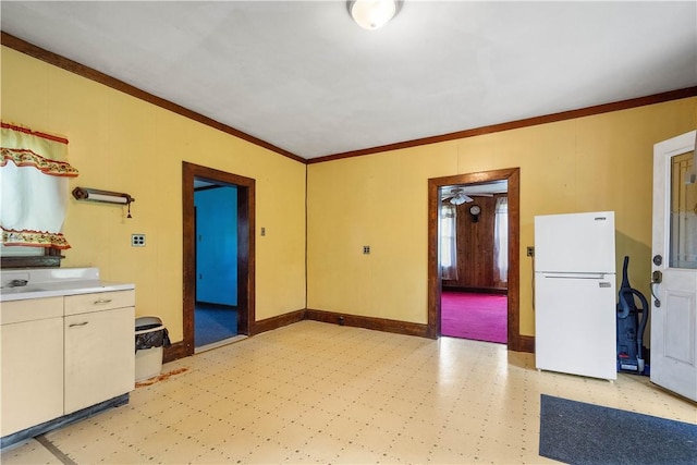 481 Dille Run Rd, Morris Twp, PA 15329 - kitchen featuring freestanding refrigerator, light flooring, crown molding, and light countertops