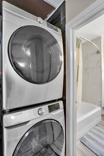 1850 Middle St, Sharpsburg, PA 15215 - washroom with stacked washer / drying machine and wood finished floors