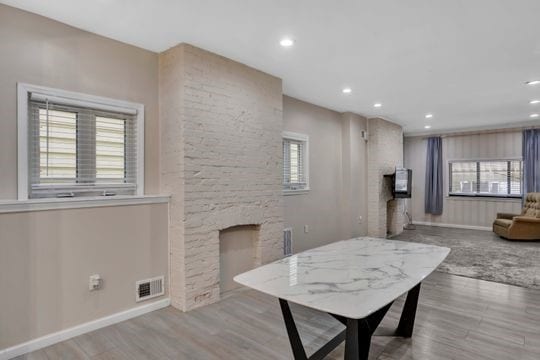 1850 Middle St, Sharpsburg, PA 15215 - living area with a stone fireplace, recessed lighting, and wood finished floors
