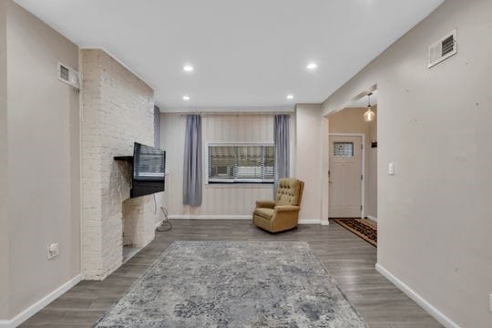 1850 Middle St, Sharpsburg, PA 15215 - living room with wood finished floors, recessed lighting, and a fireplace