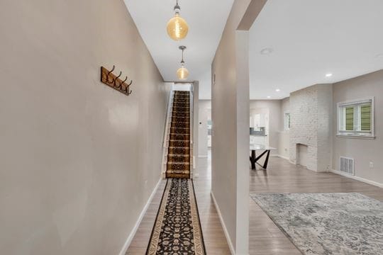 1850 Middle St, Sharpsburg, PA 15215 - corridor with wood finished floors and stairway