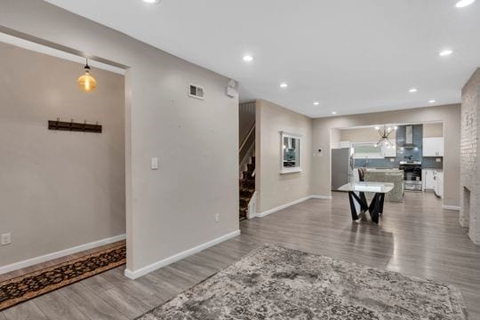 1850 Middle St, Sharpsburg, PA 15215 - interior space featuring wood finished floors, recessed lighting, and a chandelier