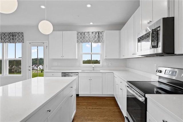 1208 Clear Springs Dr, Cecil, PA 15317 - kitchen featuring stainless steel appliances, light countertops, recessed lighting, white cabinetry, and hanging light fixtures