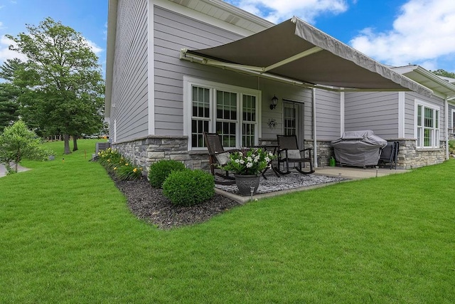 113 Dano Dr Unit 37, Ohioville, PA 15009 - rear view of house featuring stone siding, a yard, and a patio area