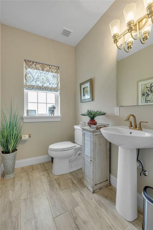 113 Dano Dr Unit 37, Ohioville, PA 15009 - bathroom with toilet and a chandelier