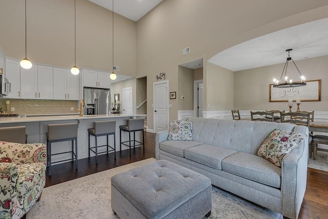 113 Dano Dr Unit 37, Ohioville, PA 15009 - living area with a chandelier, dark wood finished floors, and a high ceiling