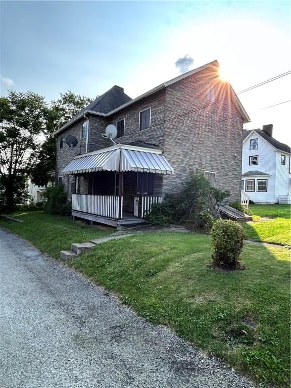 431 Washington Ave, Leechburg Boro, PA 15656 - back of property featuring stone siding and a yard