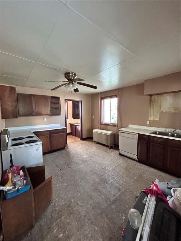 431 Washington Ave, Leechburg Boro, PA 15656 - kitchen with white appliances, radiator heating unit, a ceiling fan, light countertops, and dark brown cabinets
