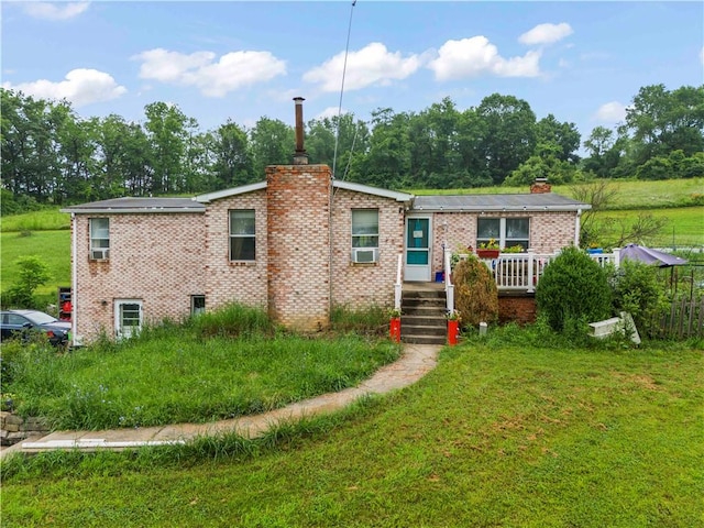 465 Sugar Run Rd, Nottingham, PA 15330 - view of front of property featuring a chimney, a front yard, and brick siding