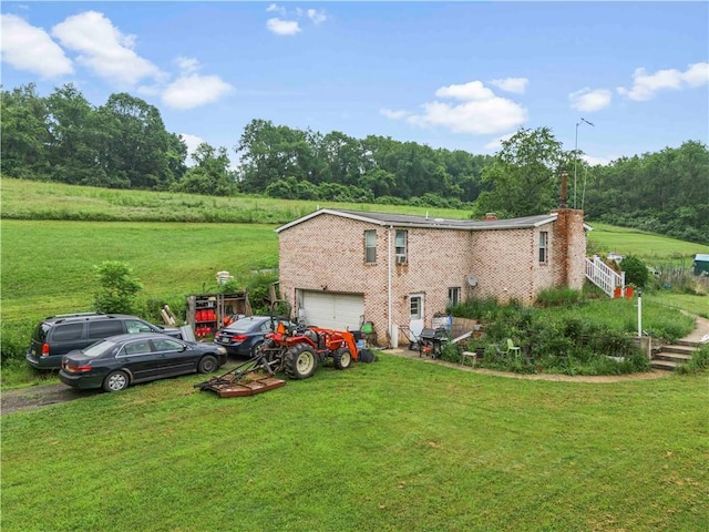465 Sugar Run Rd, Nottingham, PA 15330 - view of home's exterior with an attached garage, a yard, and a chimney