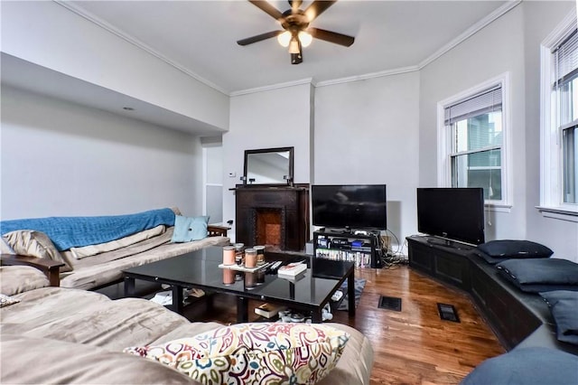 118 S 17th St, South Side, PA 15203 - living room featuring wood finished floors, crown molding, a ceiling fan, and a fireplace