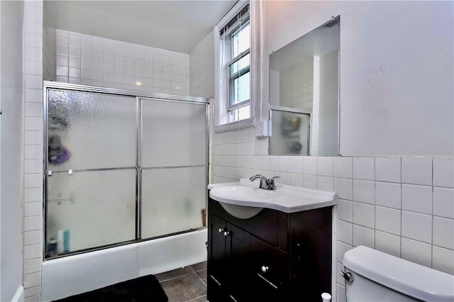 118 S 17th St, South Side, PA 15203 - full bath featuring tile walls, vanity, combined bath / shower with glass door, and tile patterned flooring