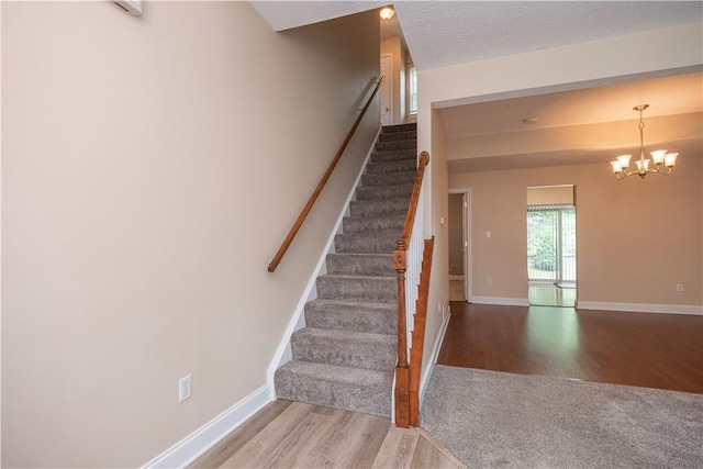 108 Arthur Ct, Richland, PA 15044 - stairway featuring wood finished floors and a chandelier