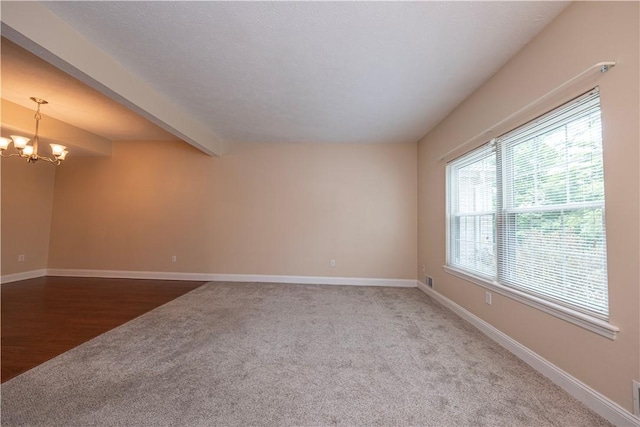 108 Arthur Ct, Richland, PA 15044 - carpeted empty room featuring a chandelier and beam ceiling