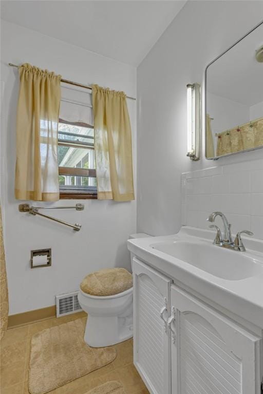 320 Wilson Ave, Beaver, PA 15009 - full bathroom with vanity, decorative backsplash, and tile patterned flooring