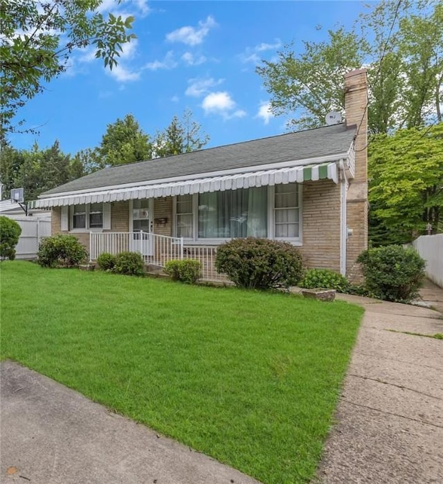 320 Wilson Ave, Beaver, PA 15009 - view of front of house featuring a chimney, a porch, brick siding, and a shingled roof