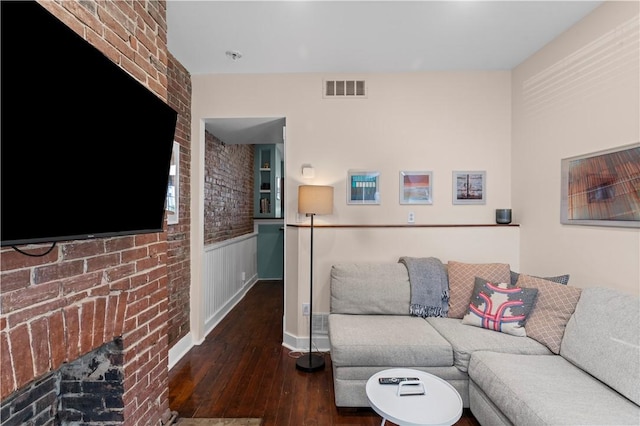 175-177 43rd 1/2 St, Lawrenceville, PA 15201 - living area with wood-type flooring, a brick fireplace, and a wainscoted wall