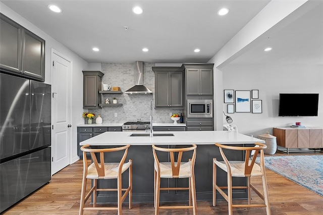 3155 Preston Way, Bridgeville, PA 15017 - kitchen featuring appliances with stainless steel finishes, wall chimney exhaust hood, decorative backsplash, a breakfast bar, and recessed lighting