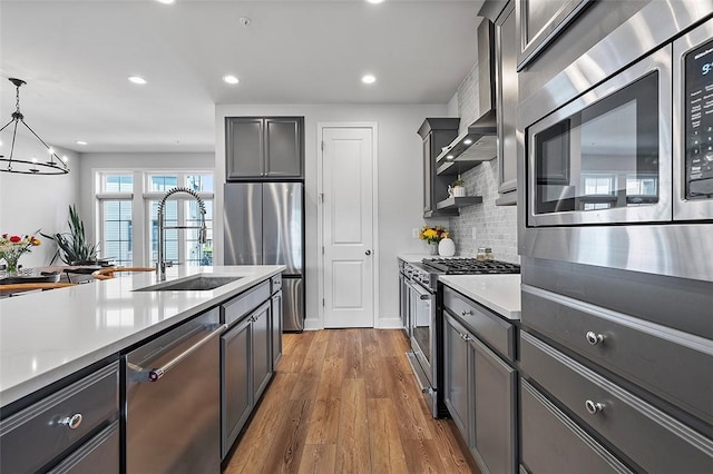 3155 Preston Way, Bridgeville, PA 15017 - kitchen featuring stainless steel appliances, wood finished floors, backsplash, light countertops, and recessed lighting