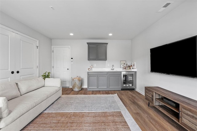 3155 Preston Way, Bridgeville, PA 15017 - living area featuring beverage cooler, wet bar, dark wood-style flooring, and recessed lighting