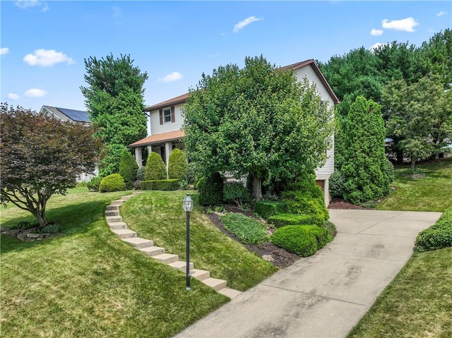 358 Shannon Cir, Daugherty Twp, PA 15066 - view of property hidden behind natural elements with a front yard and concrete driveway