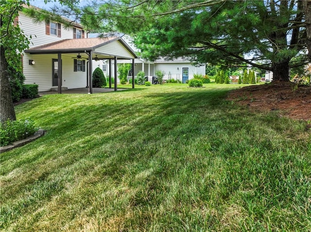 358 Shannon Cir, Daugherty Twp, PA 15066 - view of green lawn featuring ceiling fan and a patio