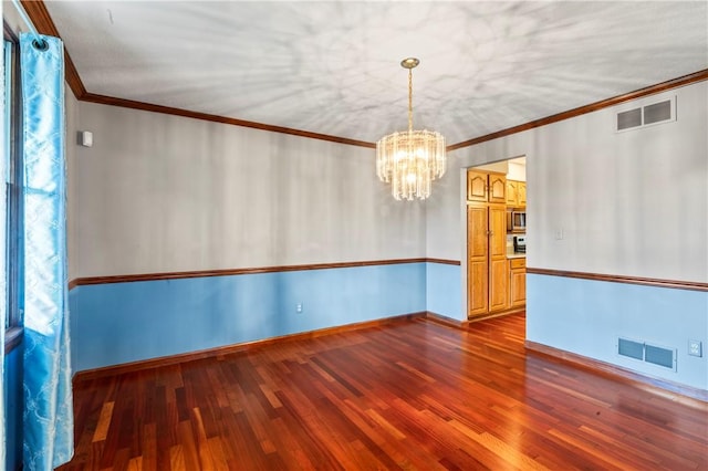 358 Shannon Cir, Daugherty Twp, PA 15066 - empty room with a chandelier, wood finished floors, and crown molding