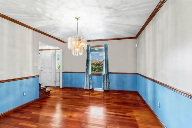 358 Shannon Cir, Daugherty Twp, PA 15066 - empty room with a chandelier, wood finished floors, crown molding, and stairs