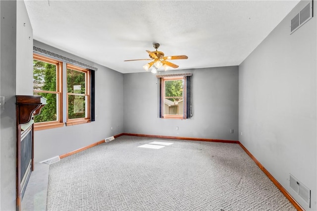 358 Shannon Cir, Daugherty Twp, PA 15066 - unfurnished room with healthy amount of natural light, carpet, and a ceiling fan