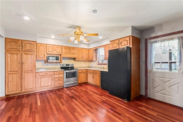 358 Shannon Cir, Daugherty Twp, PA 15066 - kitchen with black appliances, light countertops, dark wood-type flooring, a ceiling fan, and backsplash