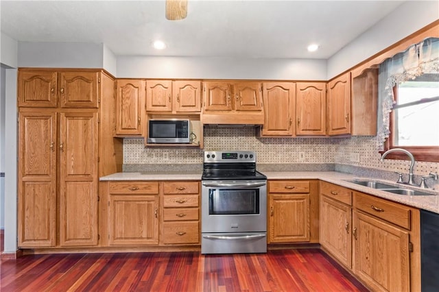 358 Shannon Cir, Daugherty Twp, PA 15066 - kitchen with stainless steel appliances, light countertops, dark wood finished floors, decorative backsplash, and under cabinet range hood