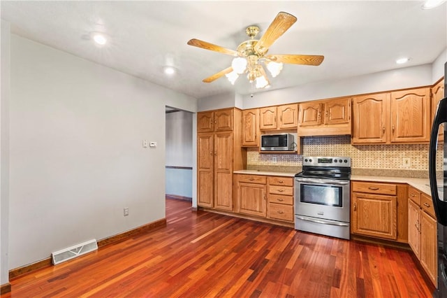 358 Shannon Cir, Daugherty Twp, PA 15066 - kitchen featuring appliances with stainless steel finishes, tasteful backsplash, light countertops, dark wood-type flooring, and a ceiling fan