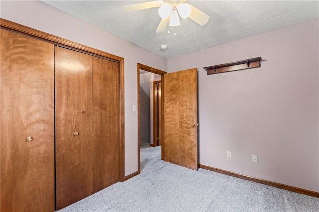 358 Shannon Cir, Daugherty Twp, PA 15066 - unfurnished bedroom featuring light carpet, a closet, and a ceiling fan
