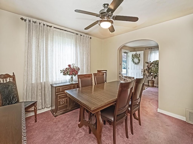 740 Churchill Ave, Penn Hills, PA 15235 - carpeted dining room with arched walkways and ceiling fan