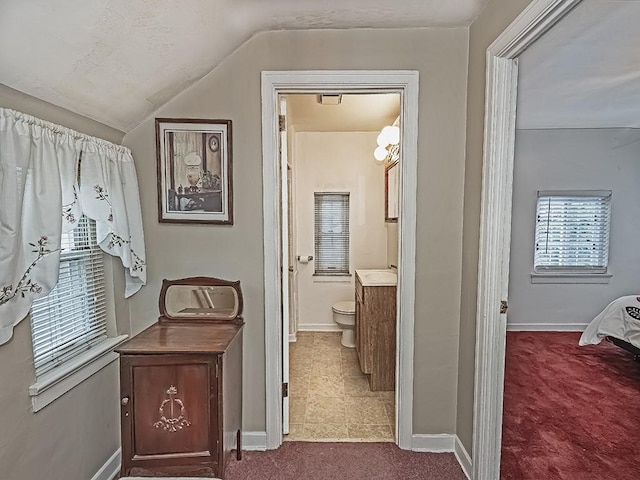 740 Churchill Ave, Penn Hills, PA 15235 - corridor featuring dark colored carpet and vaulted ceiling