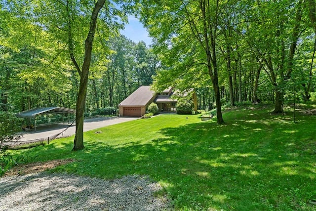 268 Glade Mills Rd, Middlesex Twp, PA 16059 - view of front of house with driveway, a front yard, a garage, and a forest view