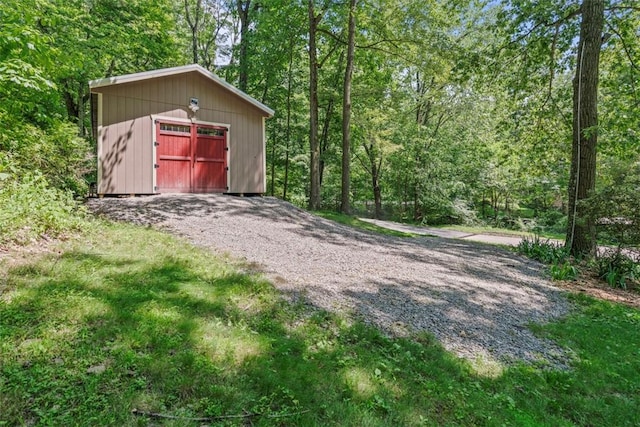 268 Glade Mills Rd, Middlesex Twp, PA 16059 - detached garage featuring driveway and a wooded view