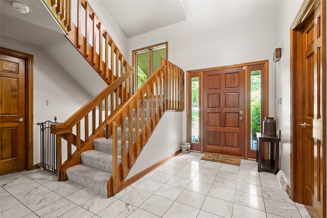268 Glade Mills Rd, Middlesex Twp, PA 16059 - foyer featuring light marble finish flooring, stairs, and a towering ceiling