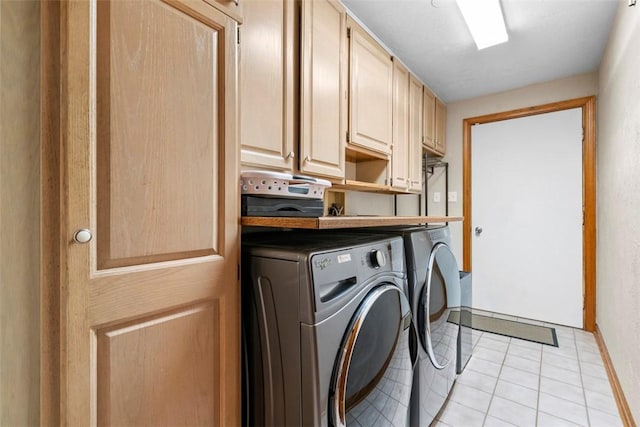 268 Glade Mills Rd, Middlesex Twp, PA 16059 - laundry area with washer and dryer, cabinet space, and light tile patterned floors