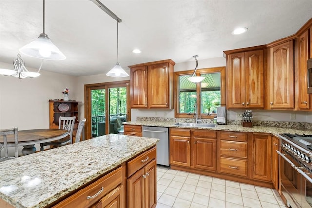 268 Glade Mills Rd, Middlesex Twp, PA 16059 - kitchen with stainless steel appliances, brown cabinetry, light stone counters, hanging light fixtures, and light tile patterned floors