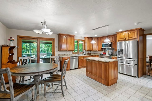 268 Glade Mills Rd, Middlesex Twp, PA 16059 - kitchen with appliances with stainless steel finishes, brown cabinets, a chandelier, a center island, and recessed lighting