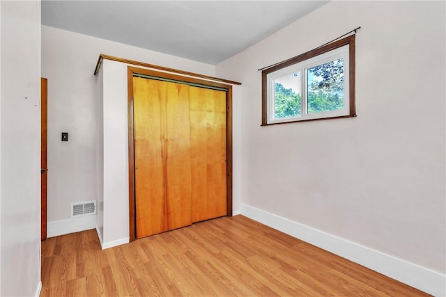 880 Patton St, Monroeville, PA 15146 - unfurnished bedroom with light wood-type flooring and a closet