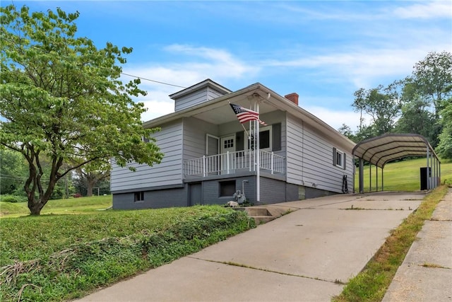 880 Patton St, Monroeville, PA 15146 - view of front of home featuring a carport, a chimney, and concrete driveway